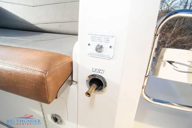 Slide: The Image of 2022 Scout 350 LXZ boat interior with leather seating and outboard flushing system. - 17