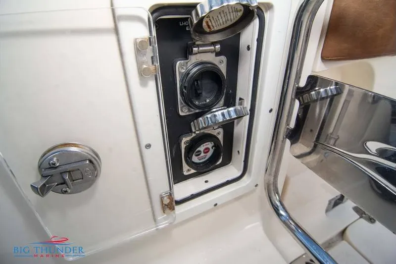 Slide: The Image of 2022 Scout 350 LXZ boat electrical panel with open access and controls. - 18
