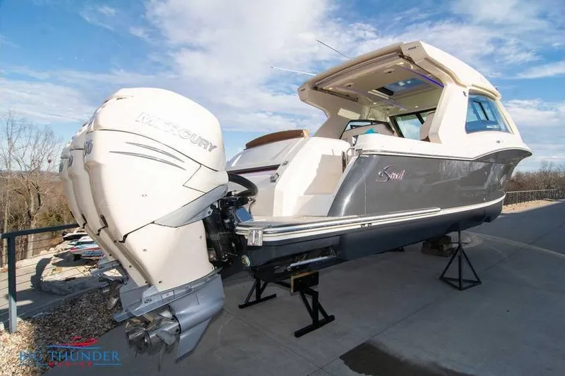 Slide: The Image of 2022 Scout 350 LXZ boat with Mercury outboard engines on display. - 2