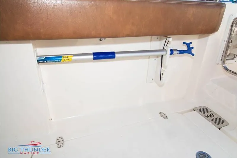 Slide: The Image of 2022 Scout 350 LXZ boat interior with mounted telescopic handle. - 23