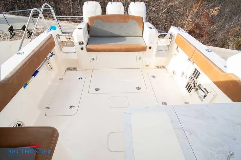 Slide: The Image of 2022 Scout 350 LXZ boat interior with seating and storage compartments. - 31