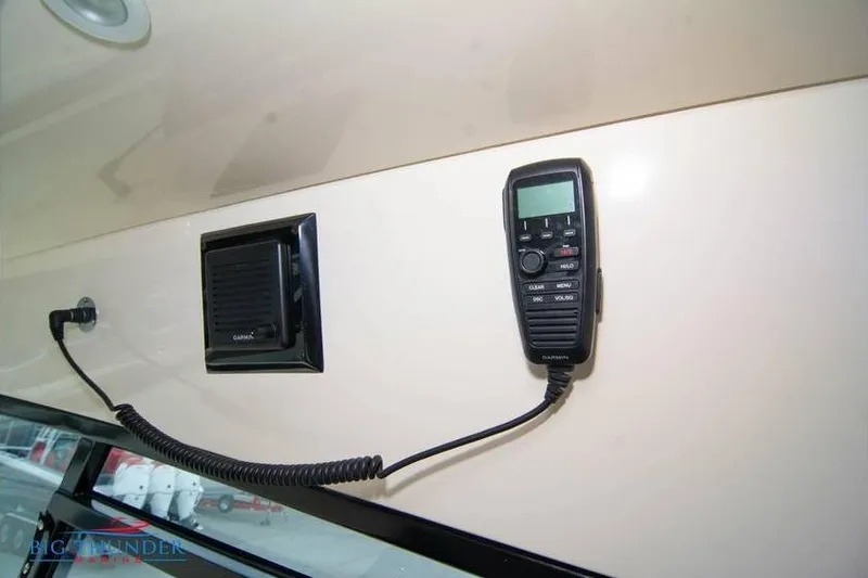 Slide: The Image of 2022 Scout 350 LXZ boat interior with Garmin communication device and speaker. - 46