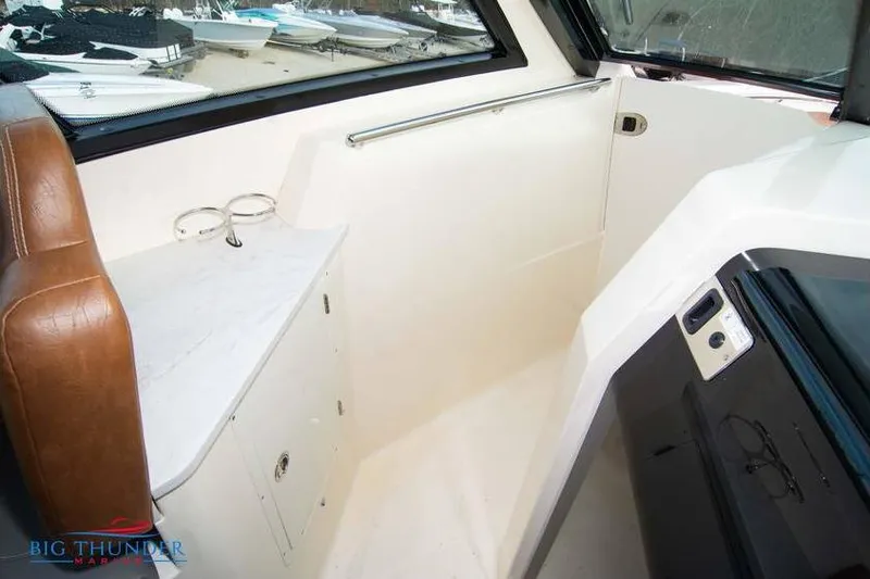 Slide: The Image of 2022 Scout 350 LXZ interior with leather seating and storage compartment. - 51