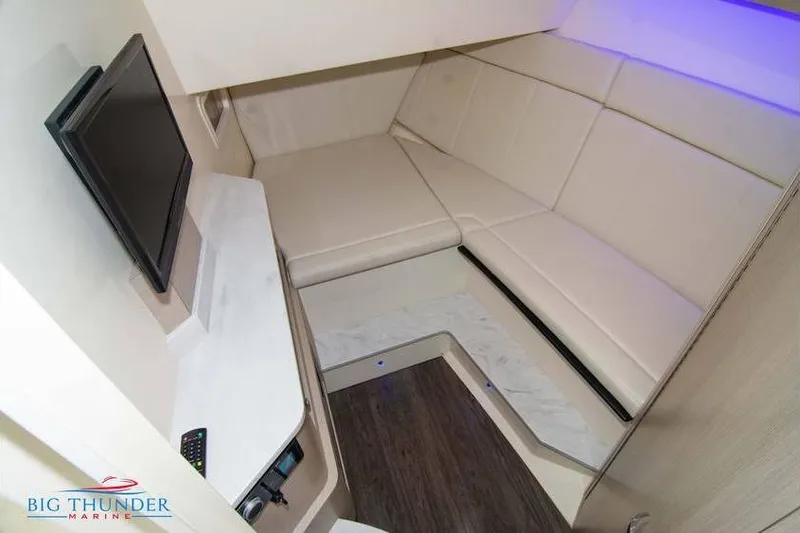 Slide: The Image of 2022 Scout 350 LXZ cabin interior with seating, TV, and modern design. - 53