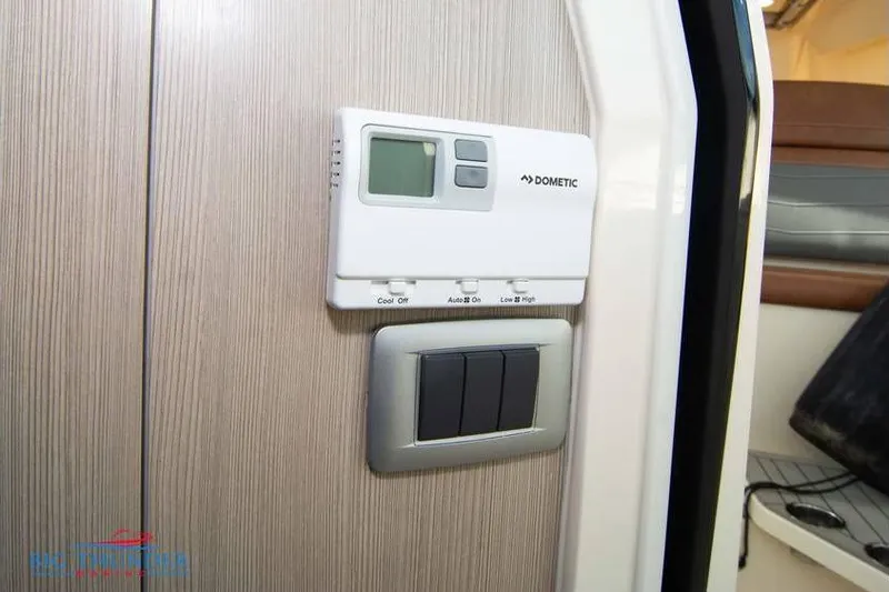 Slide: The Image of Dometic control panel on 2022 Scout 350 LXZ boat interior. - 60