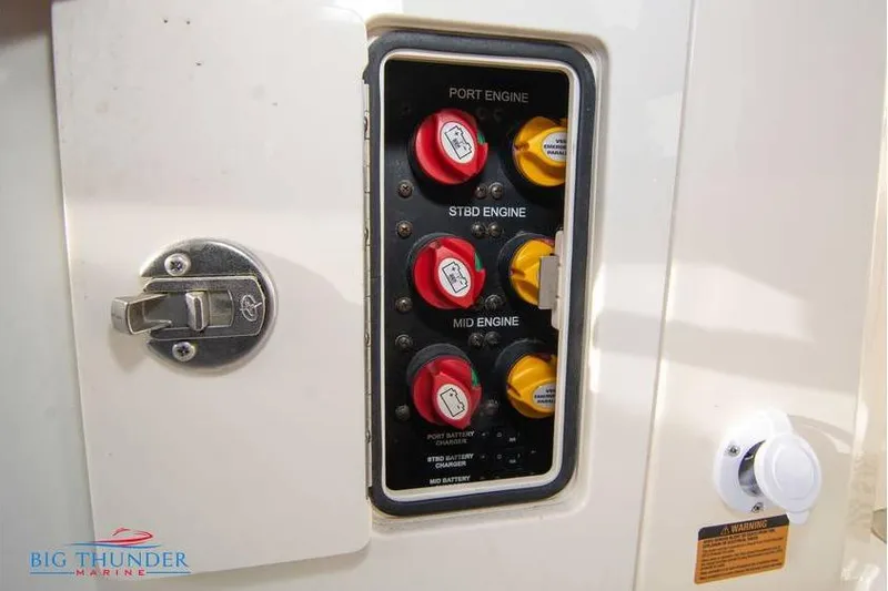 Slide: The Image of Control panel of a 2022 Scout 350 LXZ boat with engine switches. - 71