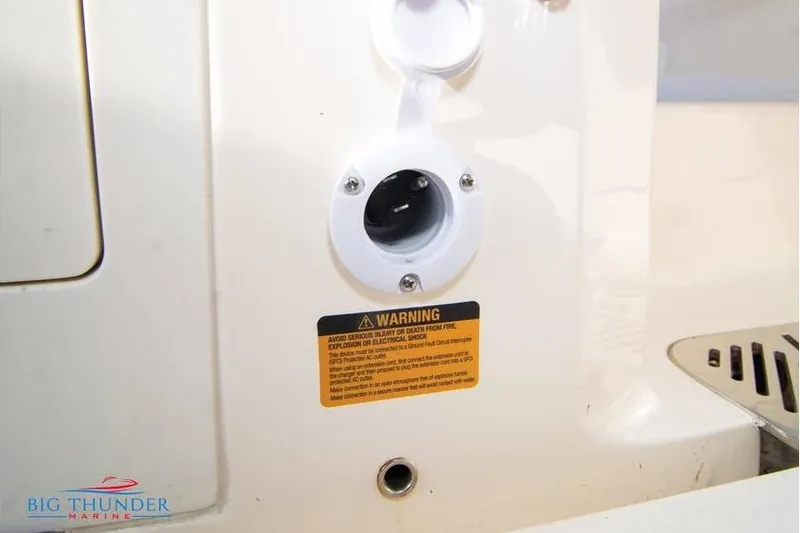 Slide: The Image of 2022 Scout 350 LXZ boat warning label and electrical outlet detail. - 72