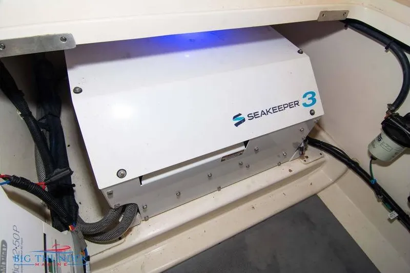 Slide: The Image of Seakeeper 3 stabilizer in 2022 Scout 350 LXZ boat interior. - 74