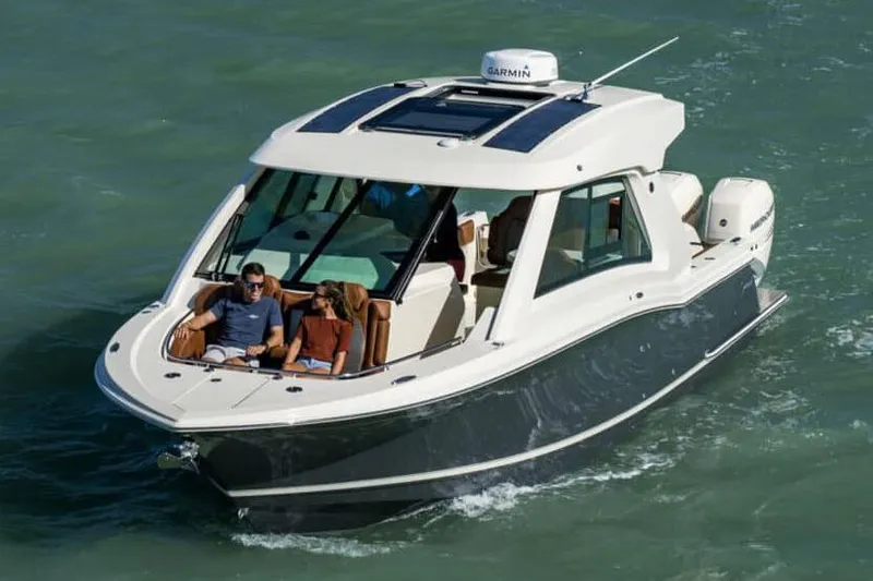 Slide: The Image of Manufacturer Provided Image: 2022 Scout 350 LXZ luxury boat cruising on water. - 76