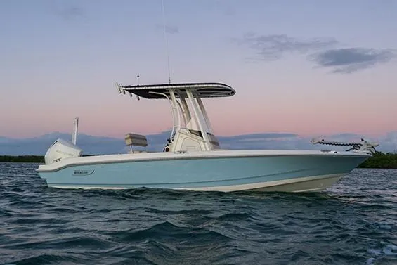 Slide: The Image of Manufacturer Provided Image: 2026 Boston Whaler 220 Dauntless boat on water at sunset. - 4