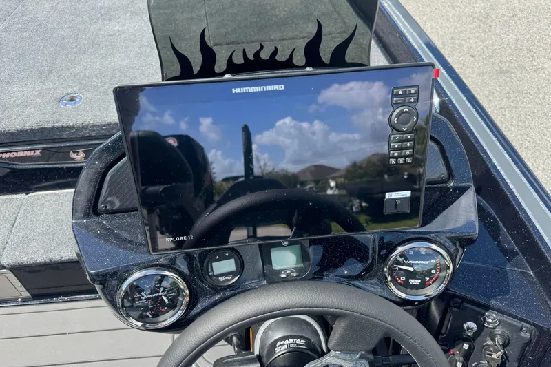 Slide: The Image of 2026 Phoenix 921 Elite X dashboard with Humminbird display and gauges. - 14