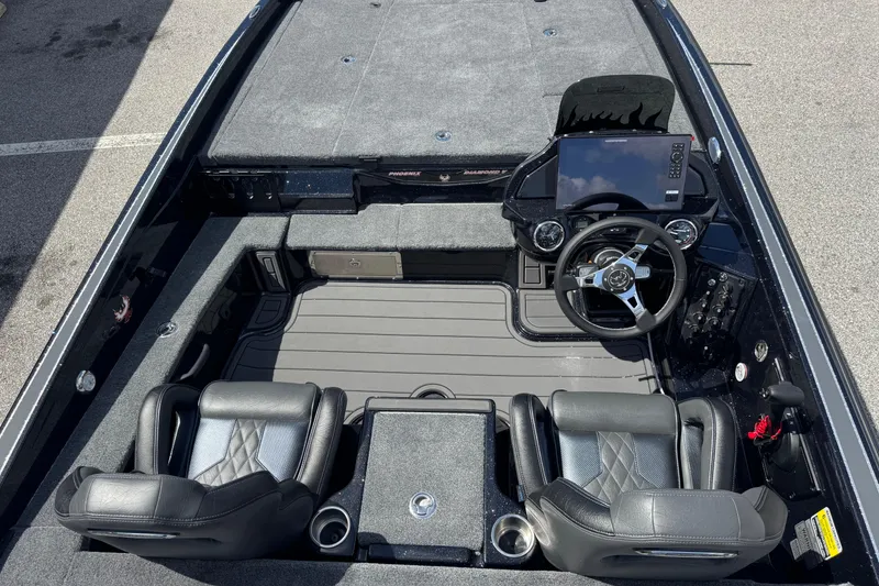 Slide: The Image of 2026 Phoenix 921 Elite X boat interior with dual seats, steering wheel, and dashboard controls. - 15
