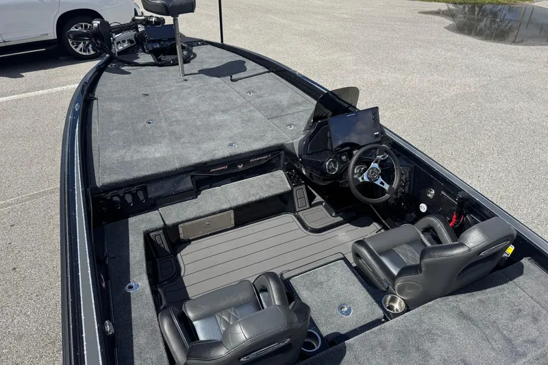 Slide: The Image of 2026 Phoenix 921 Elite X boat interior with dual seats, steering console, and spacious deck. - 16