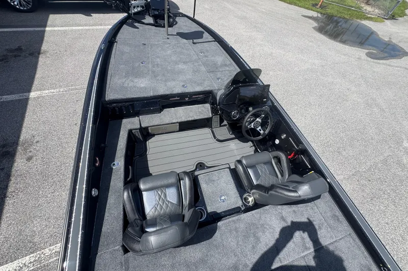 Slide: The Image of 2026 Phoenix 921 Elite X boat interior with dual seats and steering console. - 18