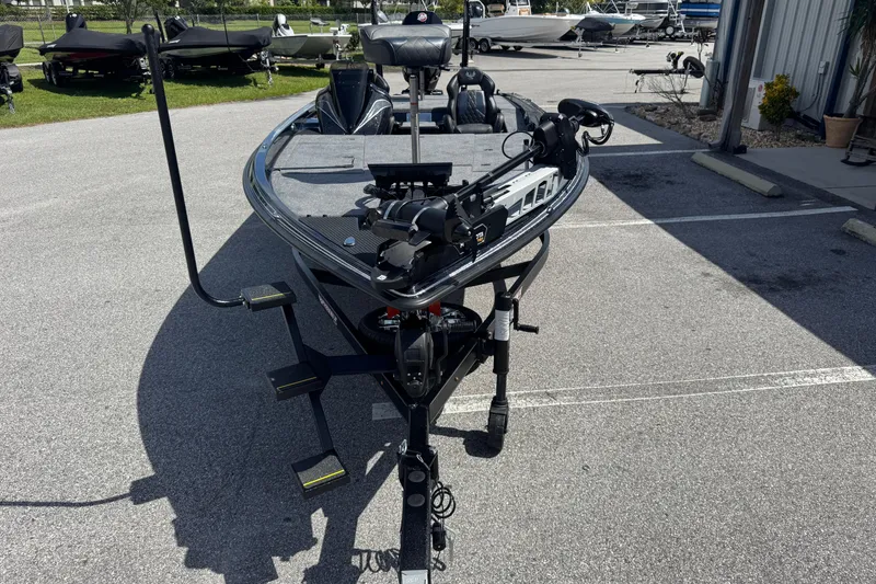 Slide: The Image of 2026 Phoenix 921 Elite X boat parked on asphalt, featuring advanced fishing equipment. - 19