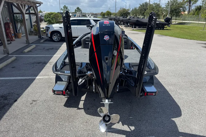 Slide: The Image of 2026 Phoenix 921 Elite X boat with powerful outboard motor in parking lot. - 20