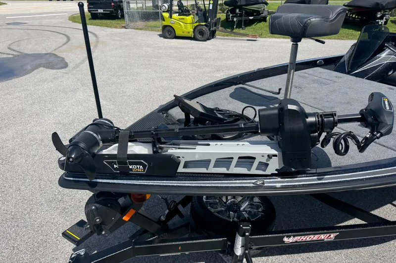 Slide: The Image of 2026 Phoenix 921 Elite X boat with Minn Kota Ultrex trolling motor on trailer. - 4