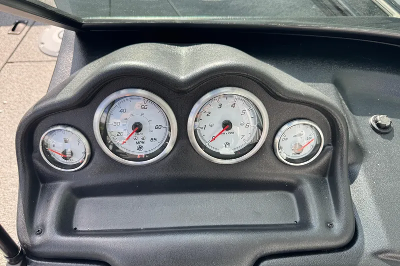 Slide: The Image of Dashboard of a 2026 Lund 1875 Fisherman boat with speedometer and fuel gauges. - 12