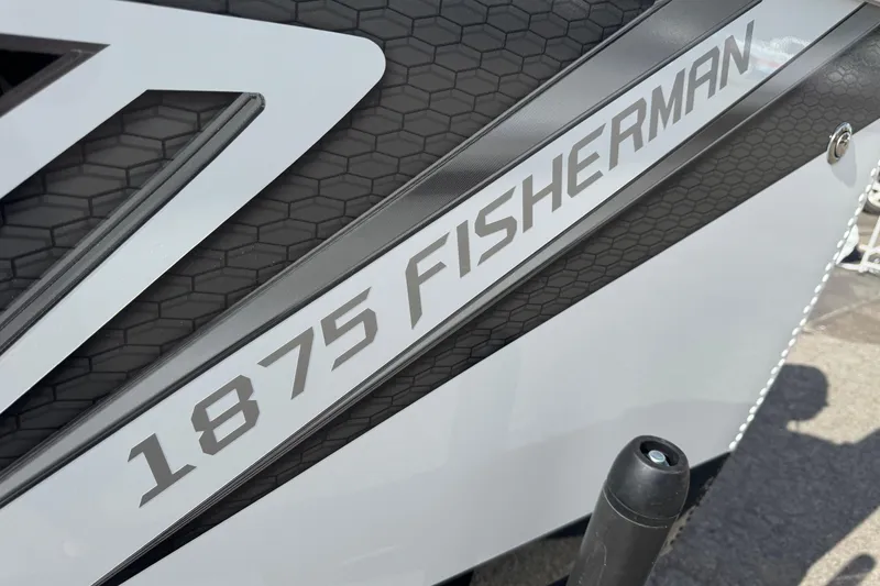 Slide: The Image of 2026 Lund 1875 Fisherman boat logo on textured surface. - 14