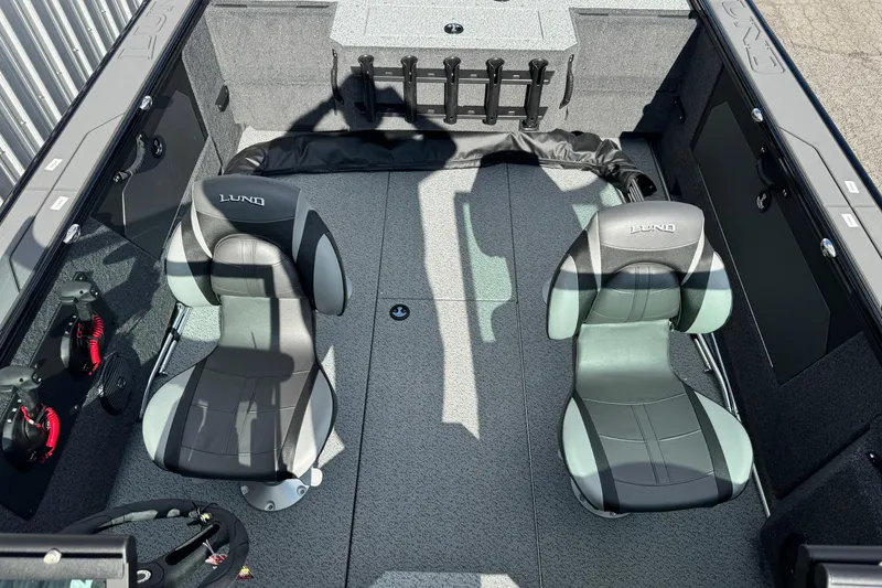Slide: The Image of 2026 Lund 1875 Fisherman boat interior with two seats and fishing rod holders. - 5