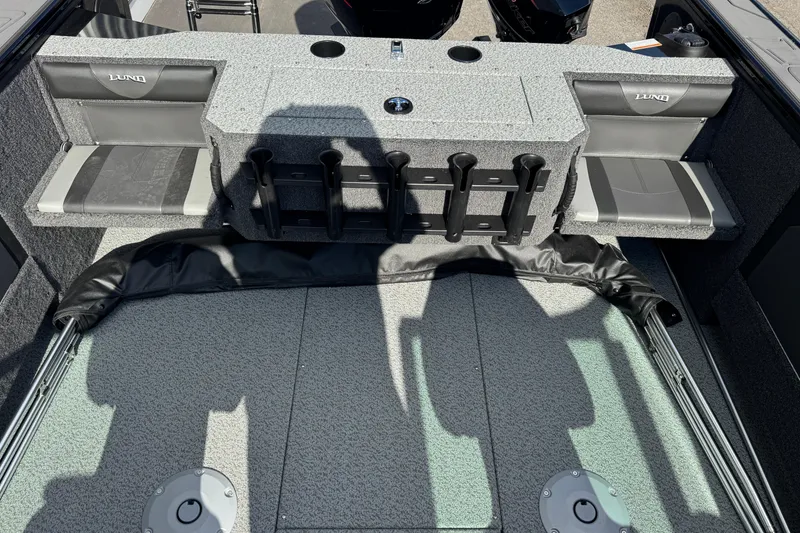 Slide: The Image of 2026 Lund 1875 Fisherman boat interior with seating and rod holders. - 6