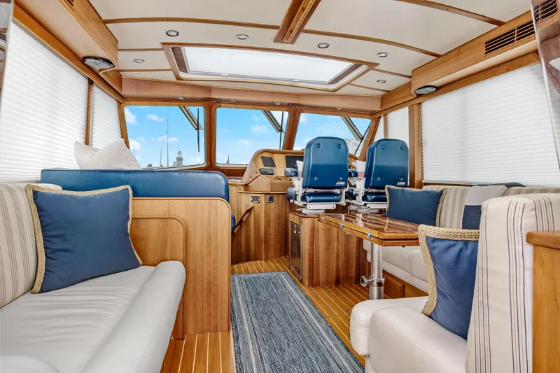Slide: The Image of Luxurious interior of 2018 Sabre 48 Salon Express yacht with elegant wood finishes and plush seating. - 16
