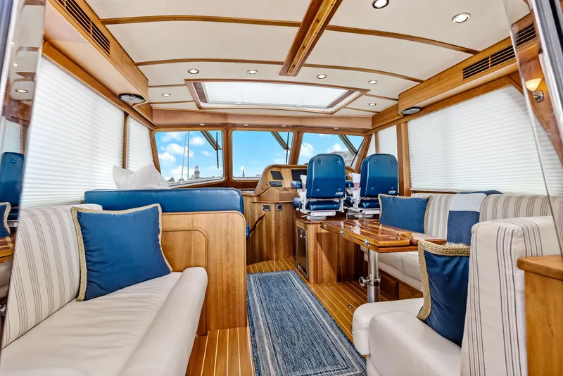 Slide: The Image of Interior of 2018 Sabre 48 Salon Express yacht with luxurious seating and helm. - 18