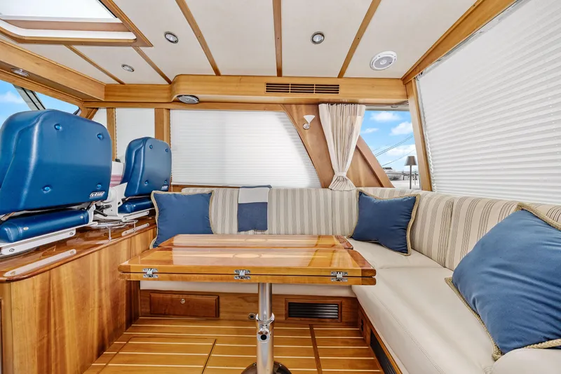 Slide: The Image of Luxurious interior of 2018 Sabre 48 Salon Express yacht with plush seating and wooden accents. - 23
