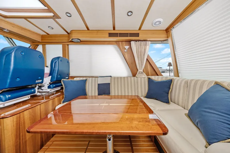 Slide: The Image of Interior of 2018 Sabre 48 Salon Express yacht with elegant seating and wooden table. - 24