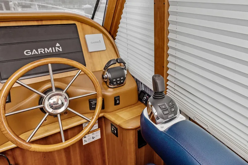 Slide: The Image of Steering wheel and controls of 2018 Sabre 48 Salon Express yacht with Garmin system. - 28