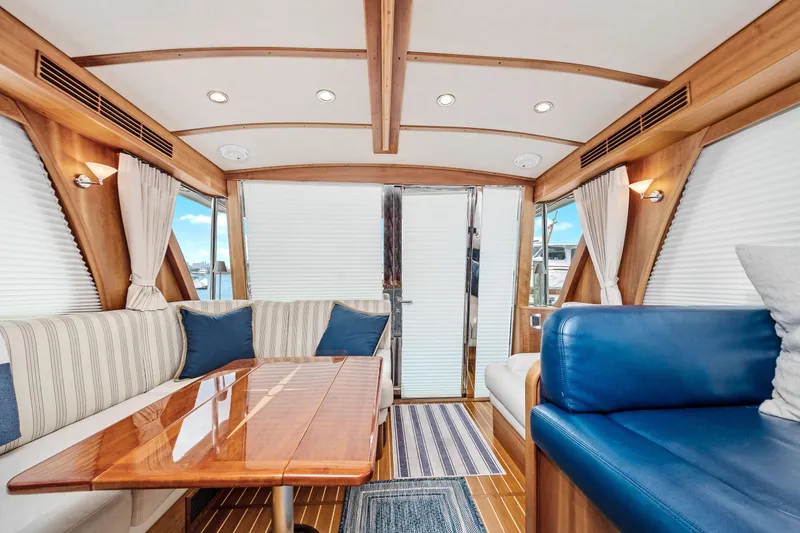 Slide: The Image of Interior of 2018 Sabre 48 Salon Express yacht with elegant seating and wooden accents. - 31