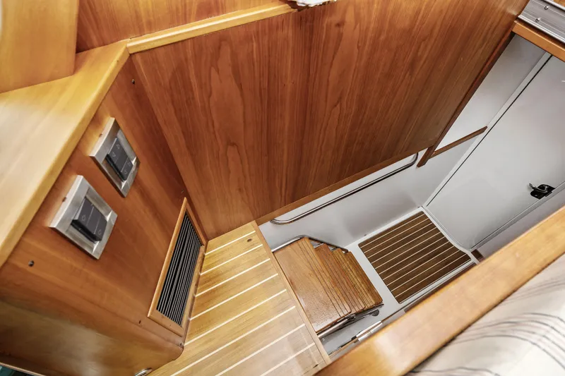 Slide: The Image of Interior stairs of 2018 Sabre 48 Salon Express yacht, featuring wooden finish and modern design. - 34