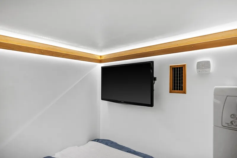 Slide: The Image of Interior of 2018 Sabre 48 Salon Express with TV, speaker, and modern lighting. - 36