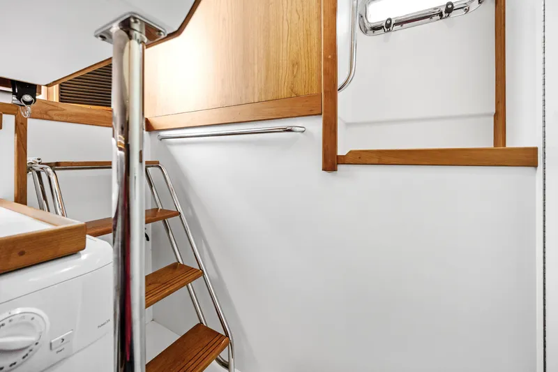 Slide: The Image of Interior of 2018 Sabre 48 Salon Express yacht with wooden stairs and modern design. - 40