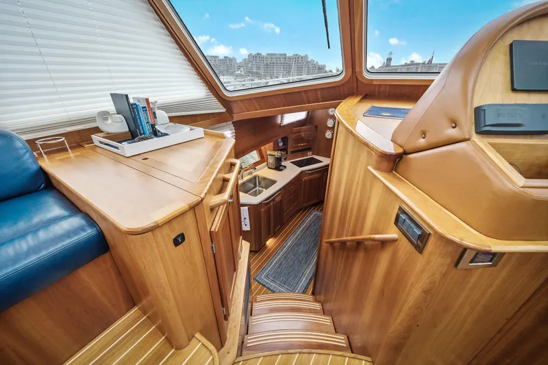Slide: The Image of Interior of 2018 Sabre 48 Salon Express yacht, featuring wooden cabinetry and modern amenities. - 41