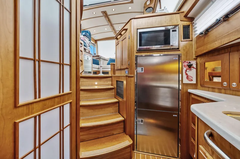 Slide: The Image of Luxurious interior of 2018 Sabre 48 Salon Express yacht with wooden finishes and modern appliances. - 44