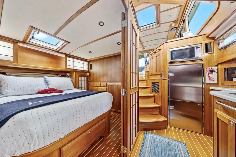Slide: The Image of Luxurious interior of 2018 Sabre 48 Salon Express yacht with wood finishes and modern amenities. - 48