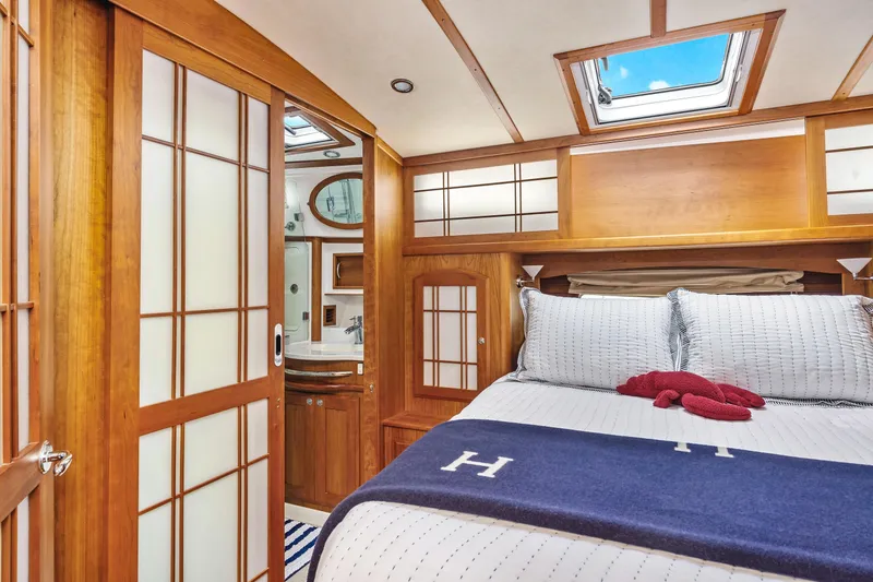 Slide: The Image of Luxurious 2018 Sabre 48 Salon Express cabin with elegant wood finishes and skylight. - 50