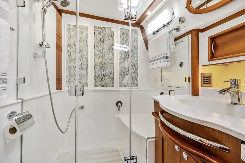 Slide: The Image of Luxurious bathroom in 2018 Sabre 48 Salon Express yacht with modern fixtures and elegant design. - 52