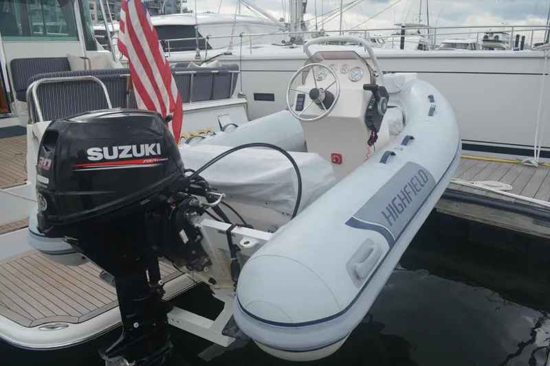Slide: The Image of Inflatable boat with Suzuki outboard motor on 2018 Sabre 48 Salon Express yacht. - 59