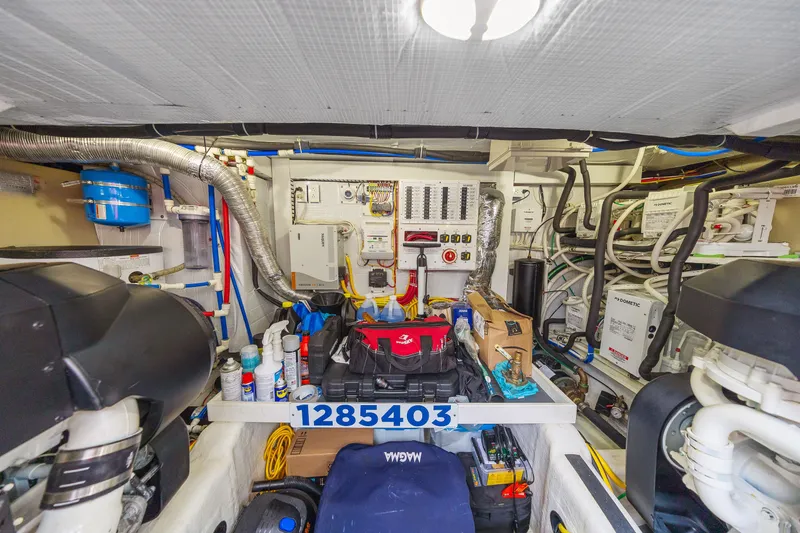 Slide: The Image of Engine room of 2018 Sabre 48 Salon Express, showcasing equipment and wiring. - 60