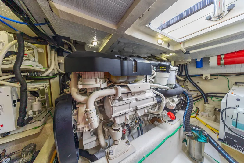 Slide: The Image of Engine room of 2018 Sabre 48 Salon Express yacht, showcasing detailed machinery and components. - 61