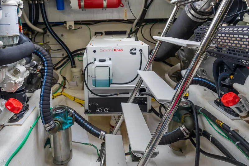 Slide: The Image of Engine room of 2018 Sabre 48 Salon Express with Cummins Onan generator. - 62