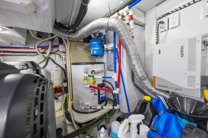 Slide: The Image of Engine room of 2018 Sabre 48 Salon Express with mechanical systems and equipment. - 64