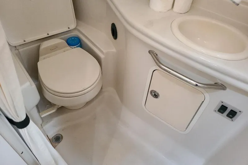 Slide: The Image of Bathroom of 2006 Sea Ray 320 Sundancer yacht with toilet and sink. - 3