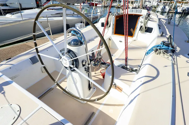 Slide: The Image of Cockpit of 2000 J Boats J/105 sailboat with steering wheel and rigging. - 11
