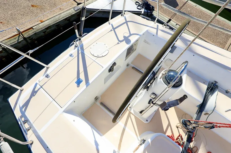 Slide: The Image of Cockpit of 2000 J Boats J/105 sailboat with steering wheel and navigational equipment. - 12
