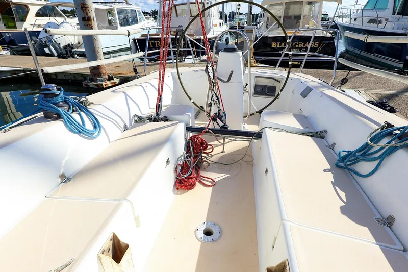 Slide: The Image of Cockpit of a 2000 J Boats J/105 sailboat with ropes and steering wheel. - 17