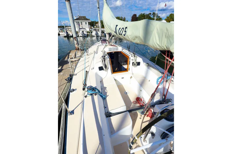Slide: The Image of 2000 J Boats J/105 sailboat docked, showcasing deck and rigging details. - 18