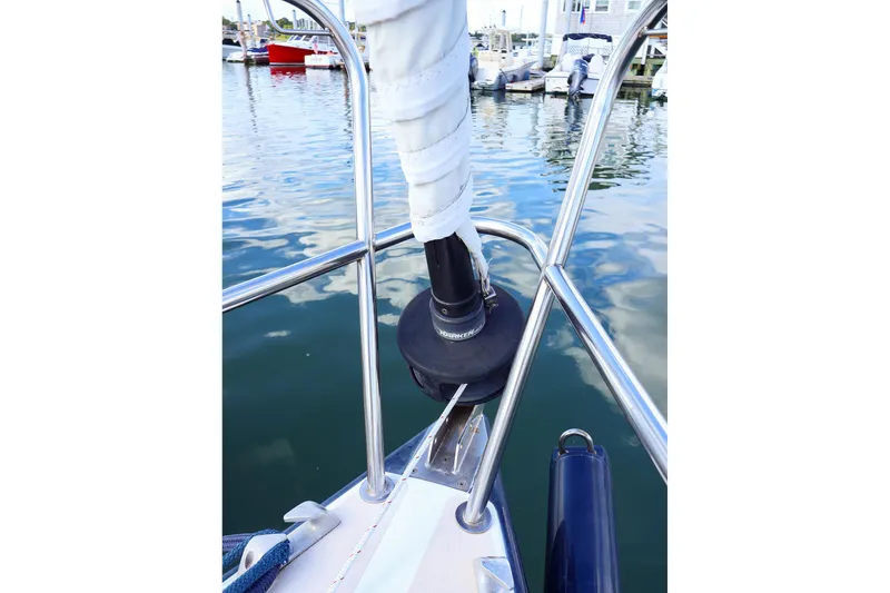 Slide: The Image of Bow of 2000 J Boats J/105 sailboat with furled sail and marina view. - 7